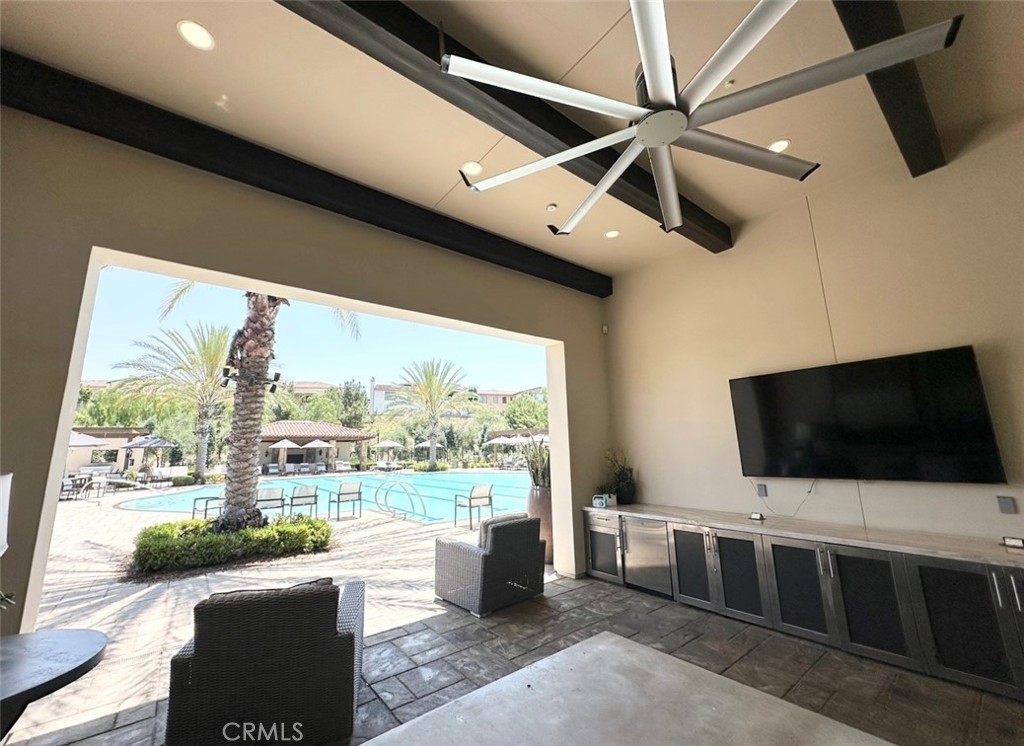 122 Scenic Crest Irvine, CA 92618 - Photo 65 of 68 a living room with flat screen tv and a floor to ceiling window