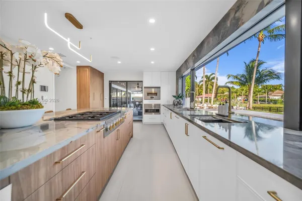 a stove top oven sitting inside of a kitchen
