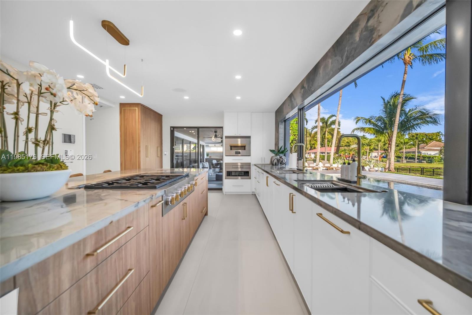 4430 Casper Court Hollywood, FL 33021 - Photo 12 of 64 a large kitchen with stainless steel appliances granite countertop a lot of counter space and a sink
