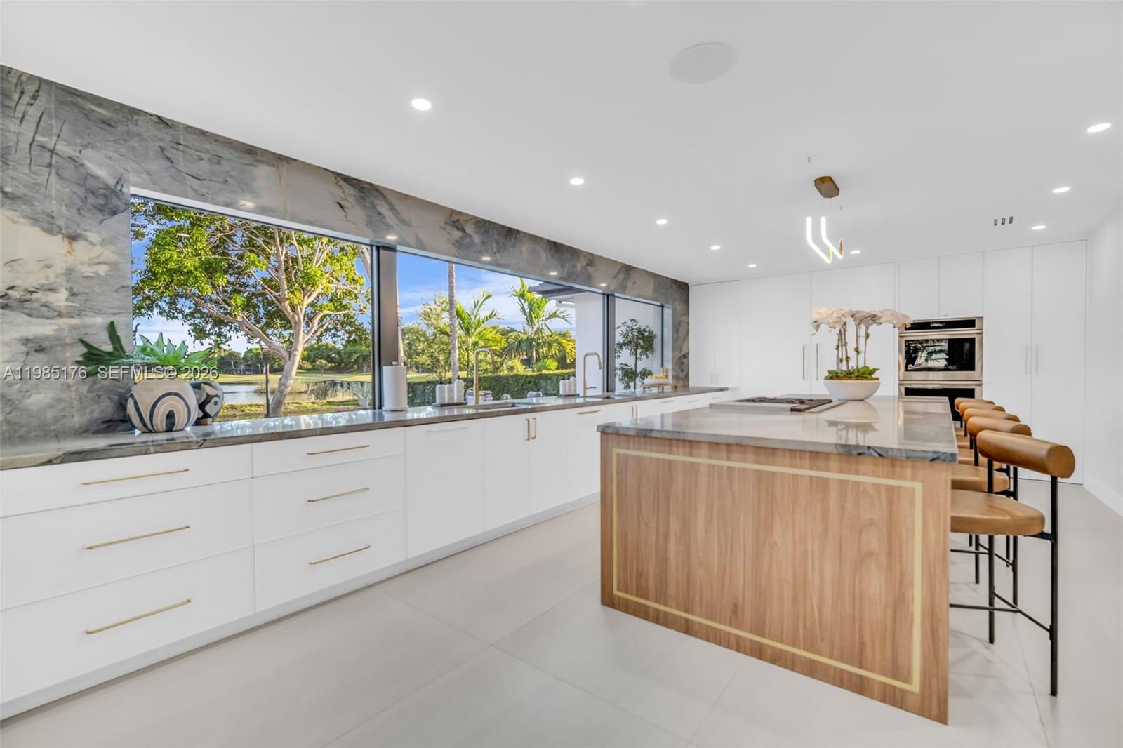 4430 Casper Court Hollywood, FL 33021 - Photo 13 of 64 a kitchen with stainless steel appliances granite countertop a stove and a sink
