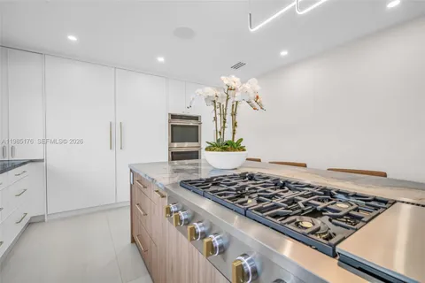 a living room with furniture and large window