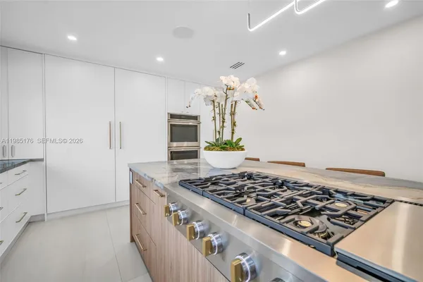 a living room with furniture and large window