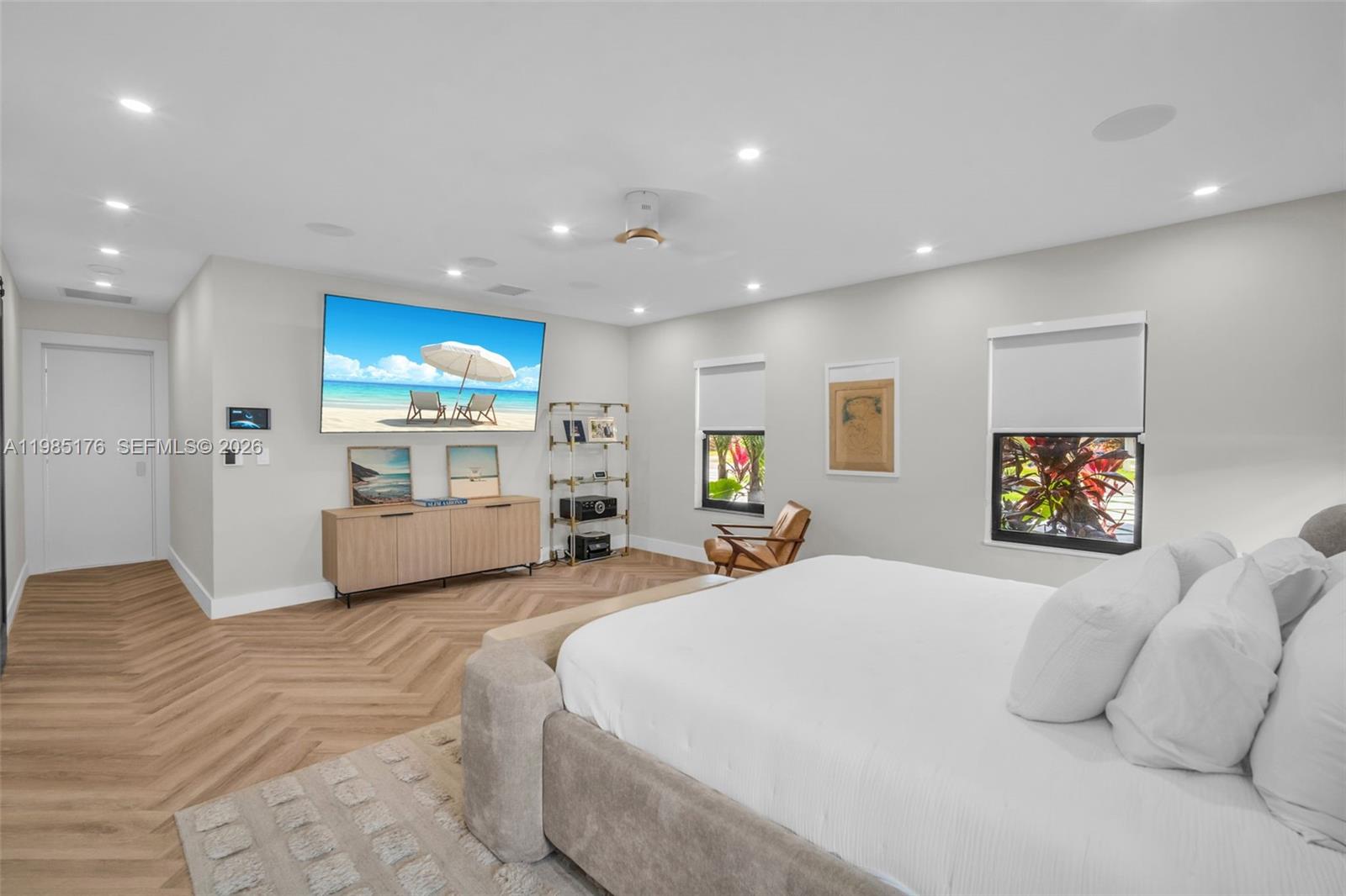 4430 Casper Court Hollywood, FL 33021 - Photo 20 of 64 a large bedroom with a bed and a view of kitchen