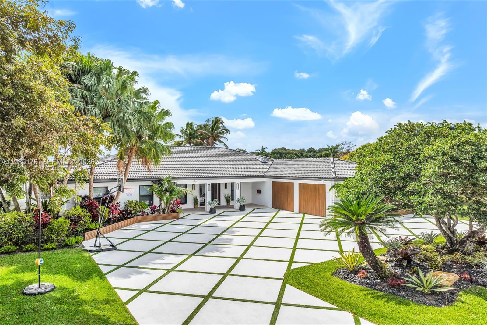 4430 Casper Court Hollywood, FL 33021 - Photo 2 of 64 a house view with a garden space