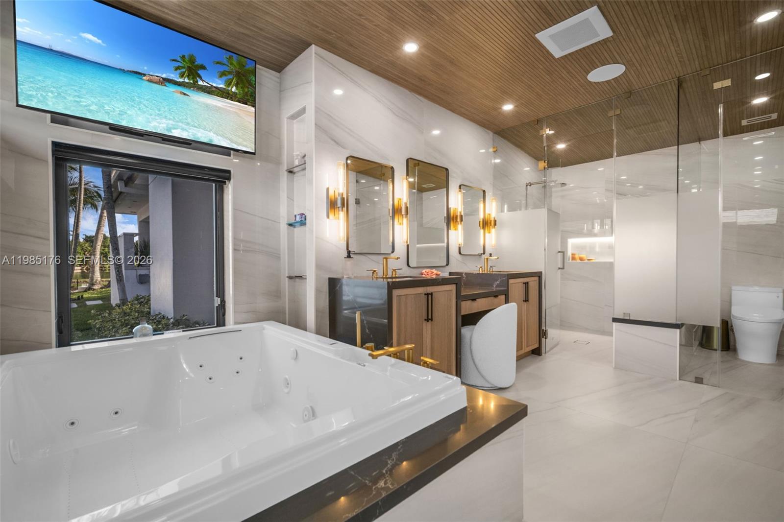 4430 Casper Court Hollywood, FL 33021 - Photo 22 of 64 a large kitchen with stainless steel appliances kitchen island a large counter top a sink and a refrigerator