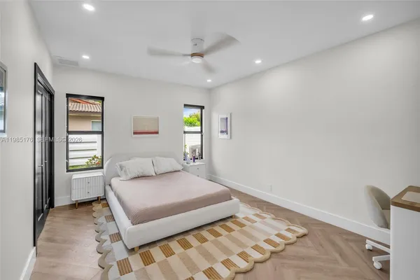 a view of a patio with a table chairs and a backyard