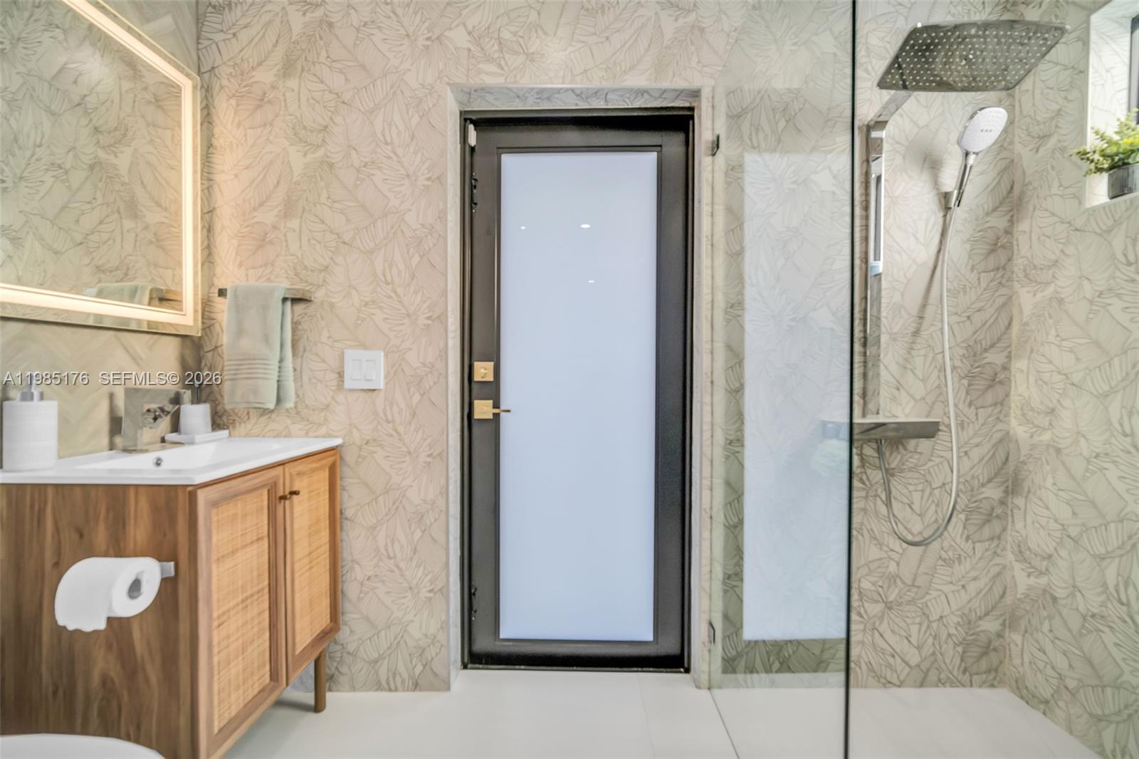 4430 Casper Court Hollywood, FL 33021 - Photo 35 of 64 a bathroom with a granite countertop sink and a mirror