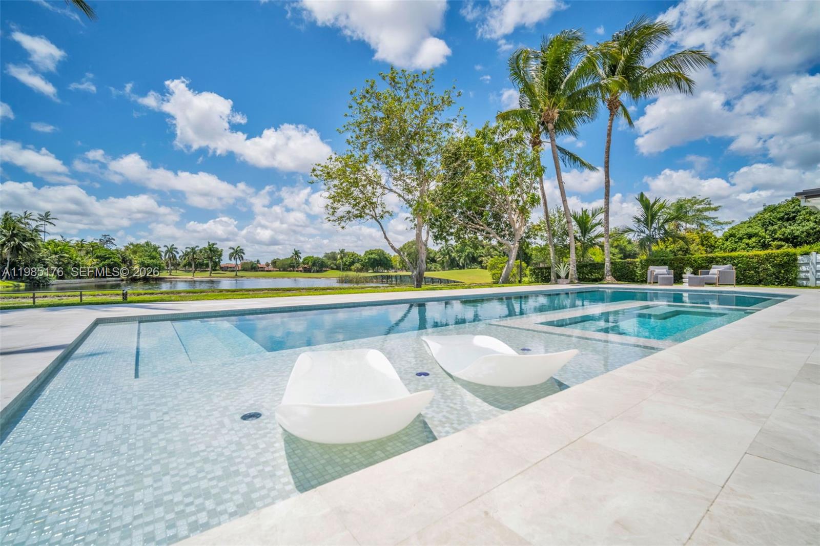 4430 Casper Court Hollywood, FL 33021 - Photo 42 of 64 a view of swimming pool with outdoor seating and yard in back