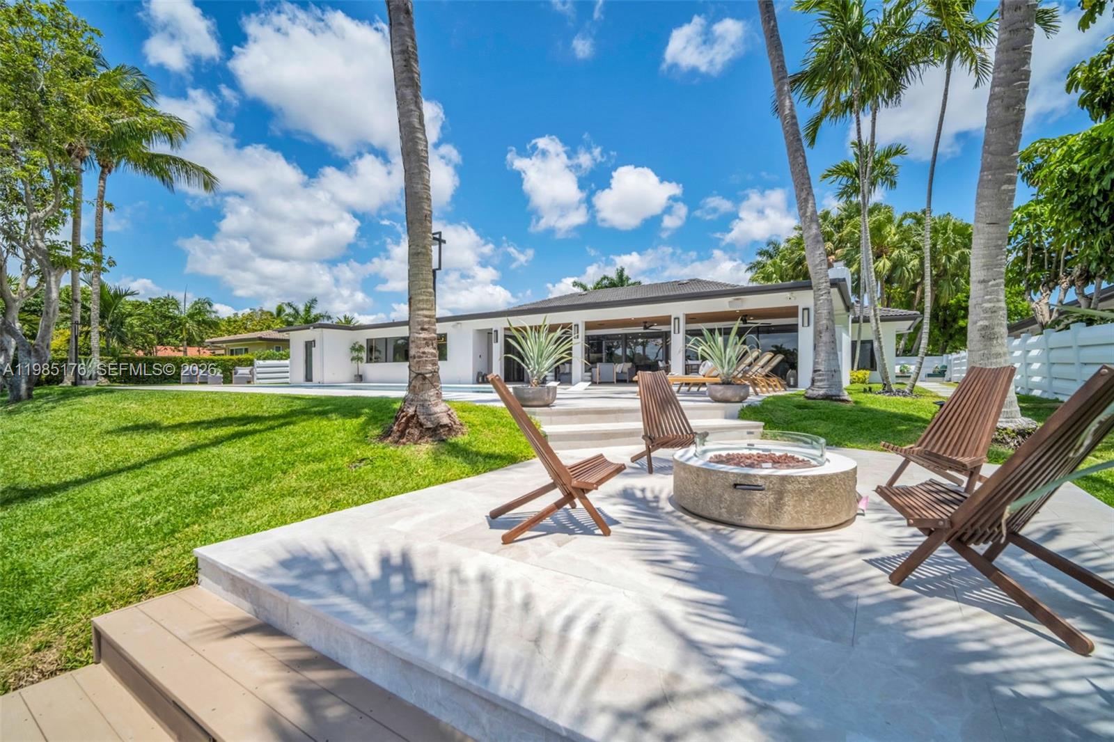 4430 Casper Court Hollywood, FL 33021 - Photo 44 of 64 a view of a house with backyard sitting area and swimming pool