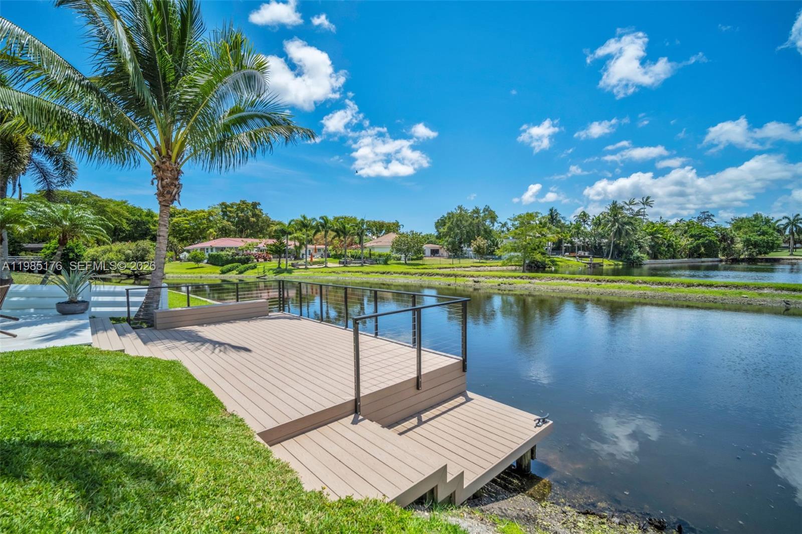 4430 Casper Court Hollywood, FL 33021 - Photo 46 of 64 a view of a lake with a house in the background