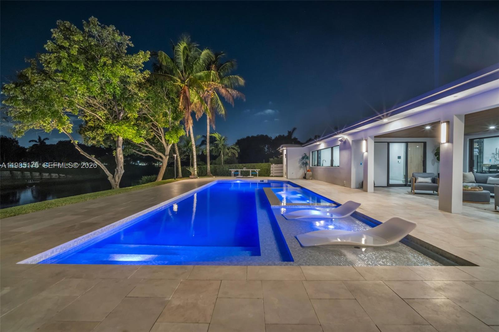 4430 Casper Court Hollywood, FL 33021 - Photo 58 of 64 a view of swimming pool with a bench in front of it