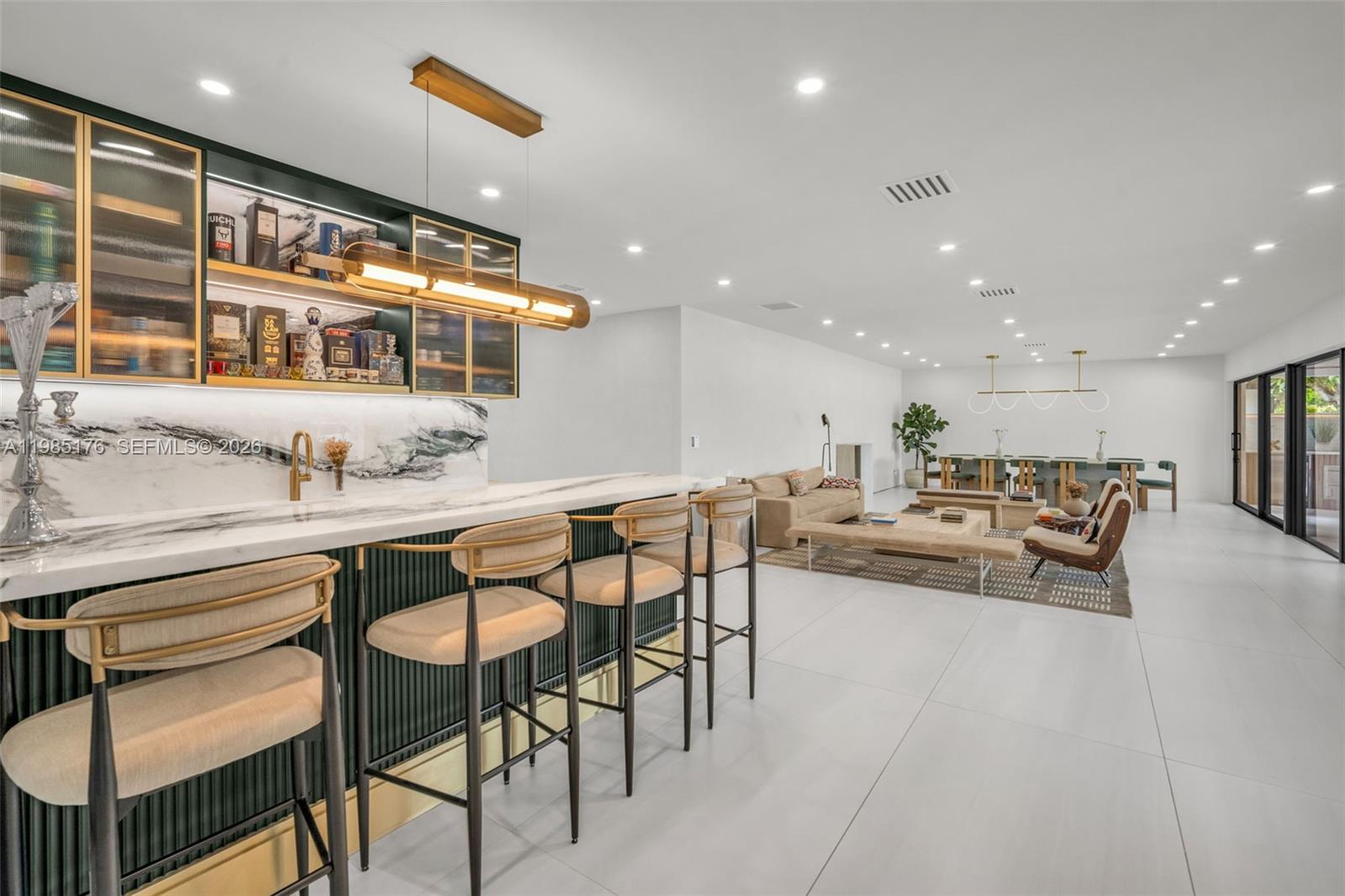 4430 Casper Court Hollywood, FL 33021 - Photo 9 of 64 a living room with furniture and a large mirror