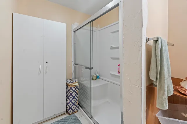 a bathroom with a bathtub and a shower