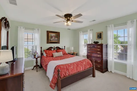 a bedroom with two beds and a window