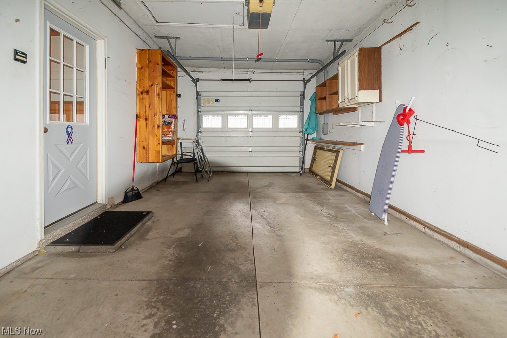 5 Pleasantview Vermilion, OH 44089 - Photo 24 of 37 Garage featuring a garage door opener
