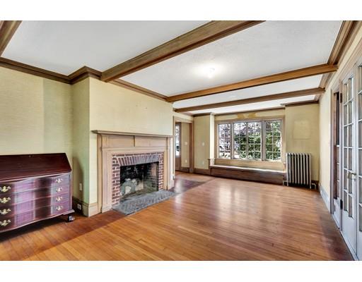 12 Everell Road Winchester, MA 01890 - Photo 5 of 21 a view of an empty room with wooden floor fireplace and a window