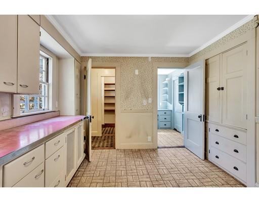 12 Everell Road Winchester, MA 01890 - Photo 7 of 21 a kitchen with a refrigerator and cabinets