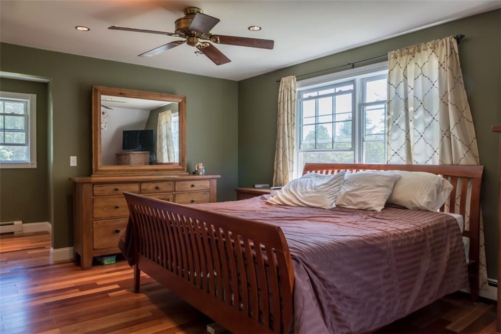 941 Lewis Hill Road Bowdoin, ME 04287 - Photo 16 of 35 This master bedroom has handsome...
