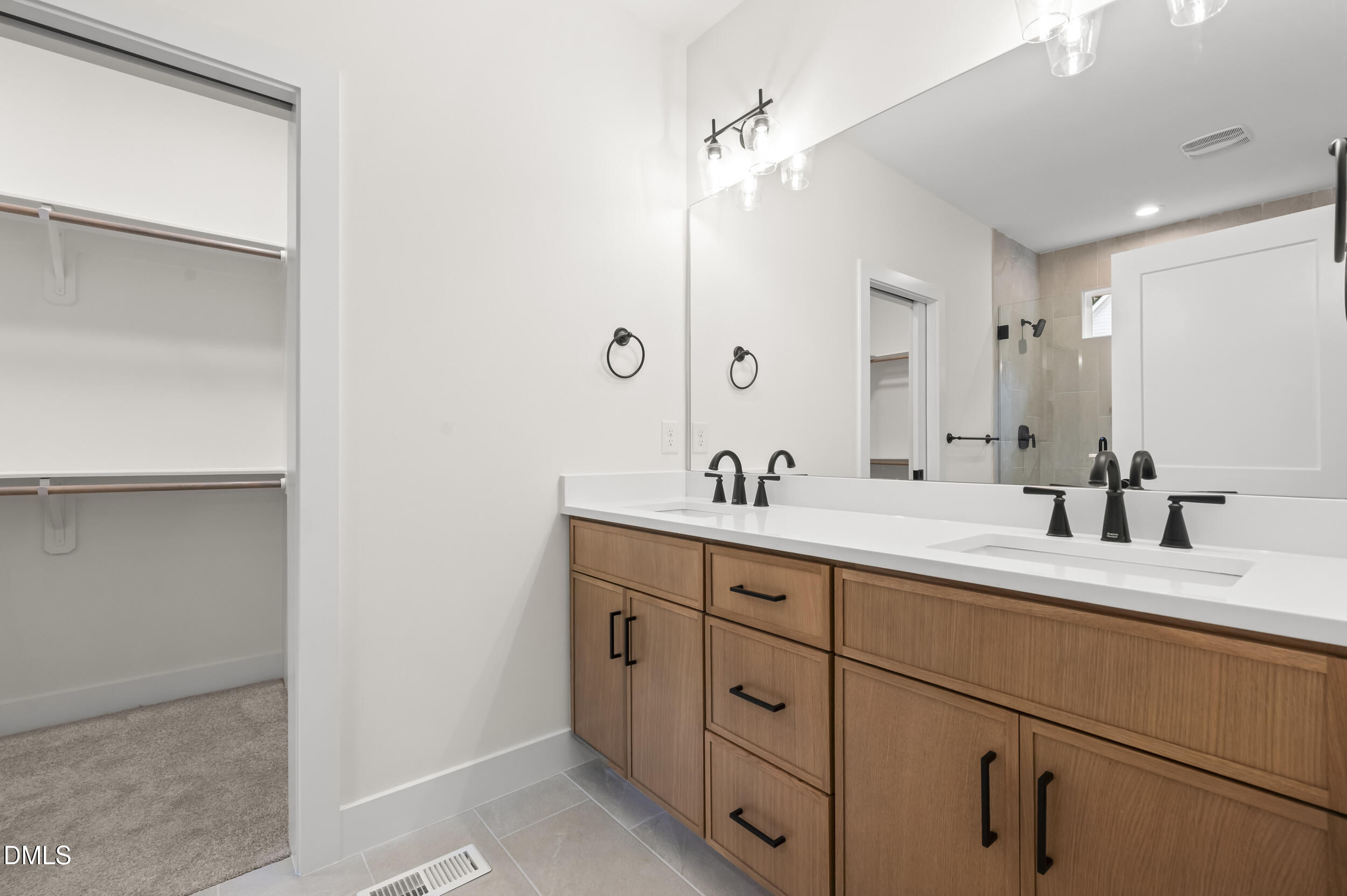 708 Grayhaven Place Raleigh, NC 27606 - Photo 16 of 33 a bathroom with a double vanity sink mirror and