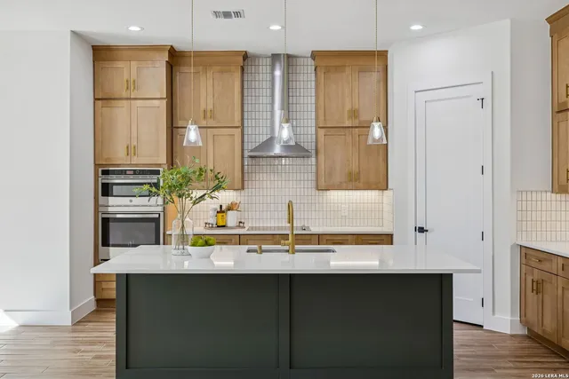 a view of a room with a window and wooden floor