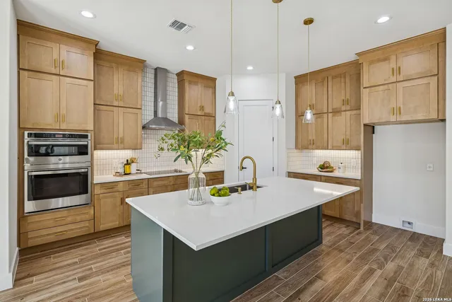 a spacious bathroom with a sink and a mirror