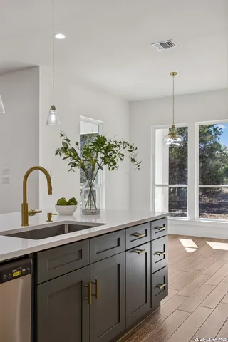 a bathroom with a sink vanity and a mirror