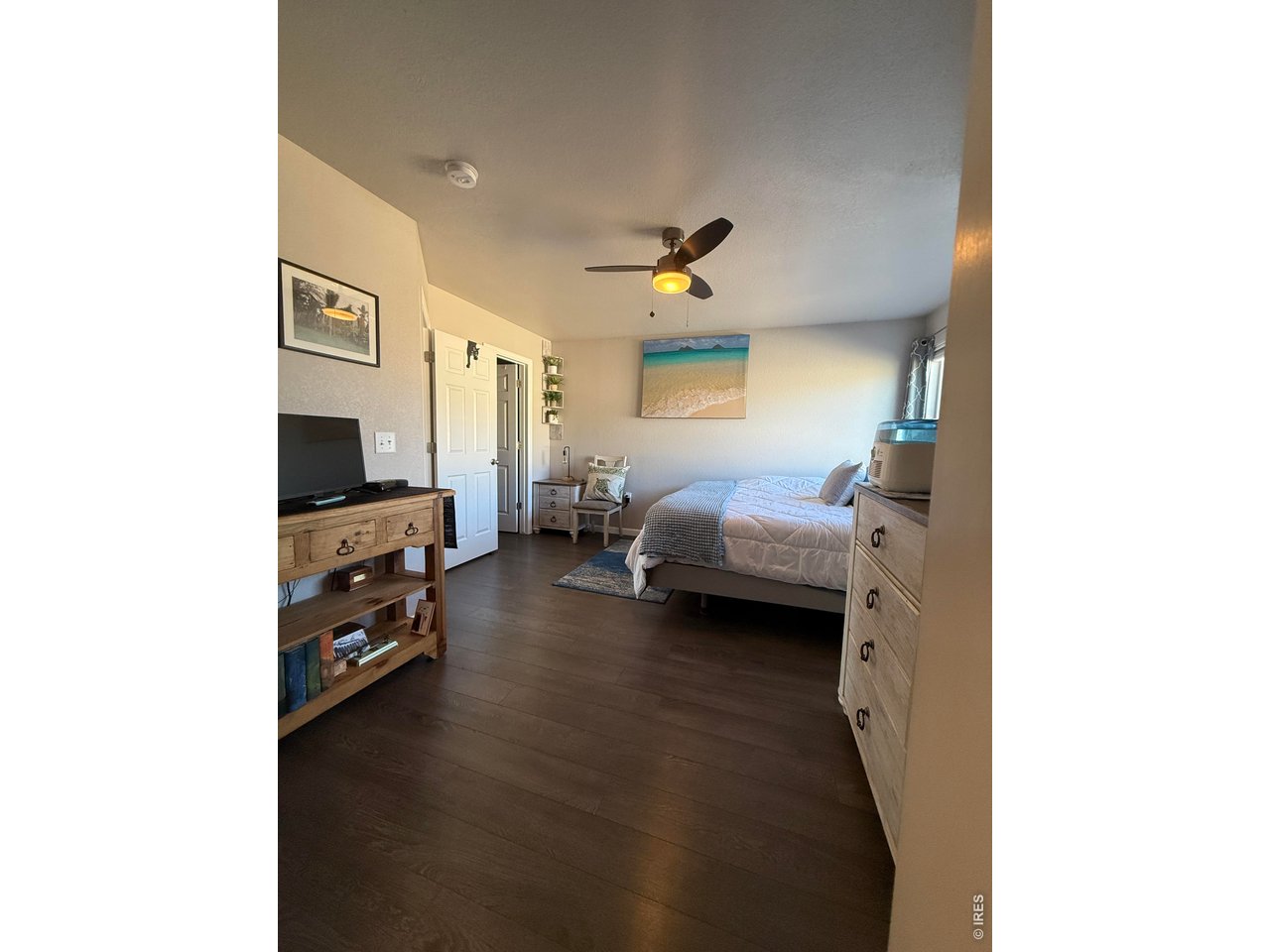 810 Gentlewind Way Berthoud, CO 80513 - Photo 16 of 35 view of primary bedroom from bathroom