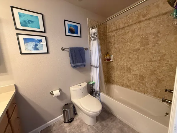 a bedroom with a bed and a tv