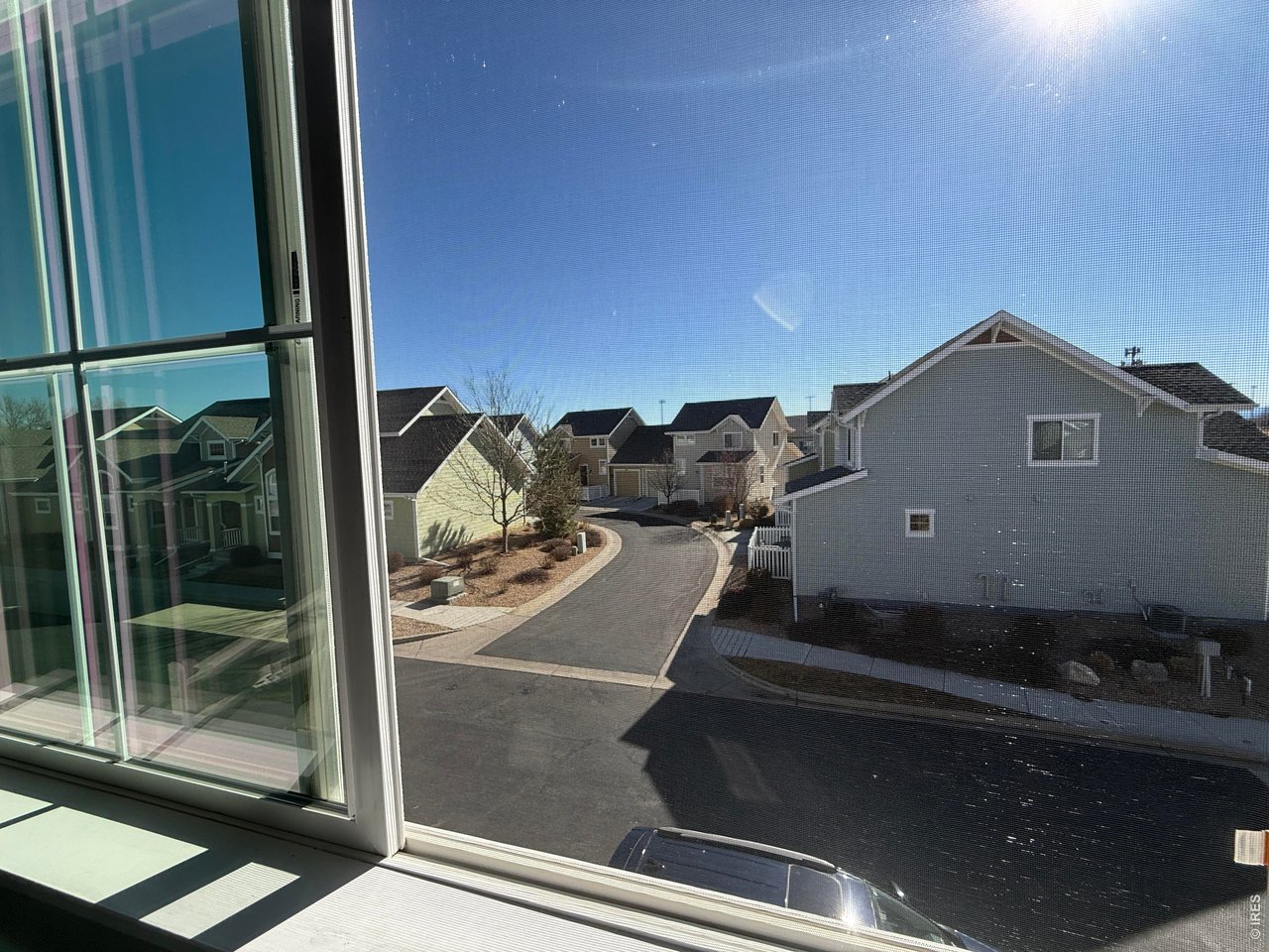 810 Gentlewind Way Berthoud, CO 80513 - Photo 25 of 35 view from second bedroom, looking towards the High School