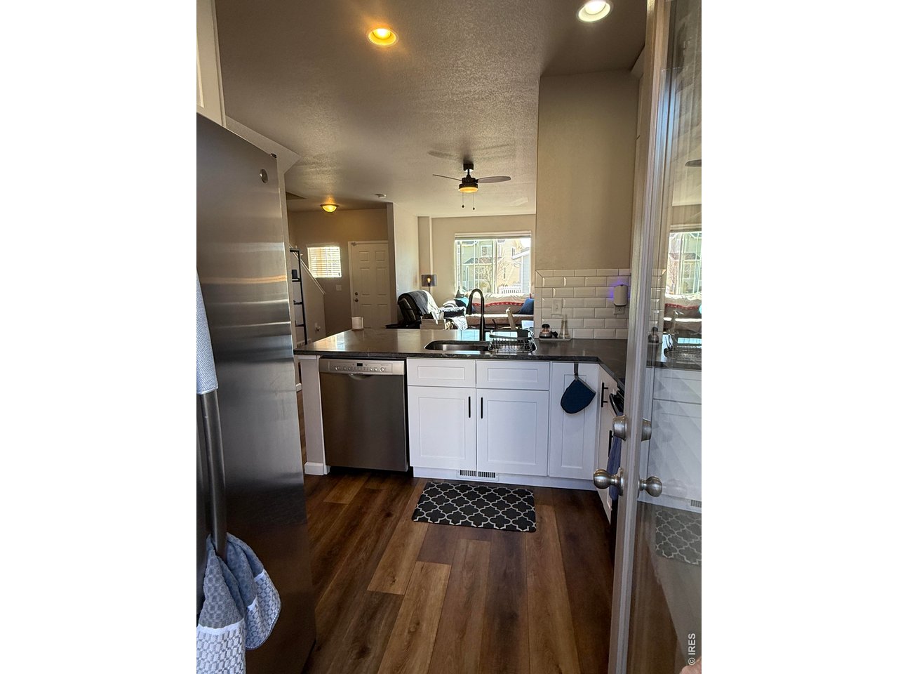 810 Gentlewind Way Berthoud, CO 80513 - Photo 5 of 35 view from back patio door into kitchen