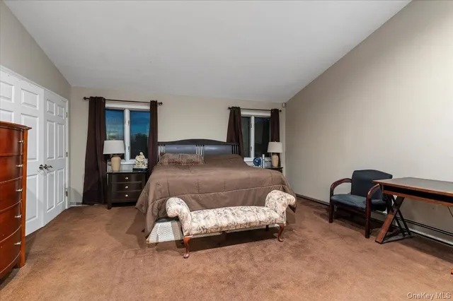 a bedroom with a bed and a desk