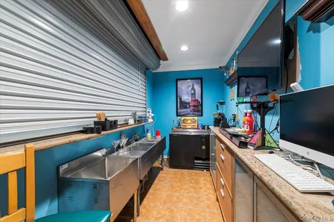 a kitchen with stainless steel appliances kitchen island granite countertop a sink stove and cabinets