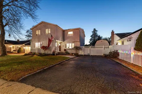 a view of a street with a building in the background