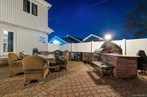 a outdoor space with patio furniture and a fireplace