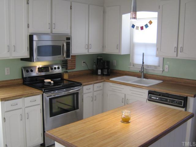 3401 Cartway Lane Raleigh, NC 27616 - Photo 4 of 12 Kitchen offers Walk in Pantry, Updated Hardware, New Sink, New Faucet, dishwasher, Brand New Stove.