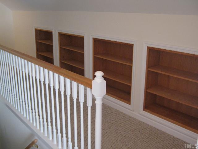 3401 Cartway Lane Raleigh, NC 27616 - Photo 9 of 12 Second Floor walkway carpeted and complete with Built in Bookshelves.