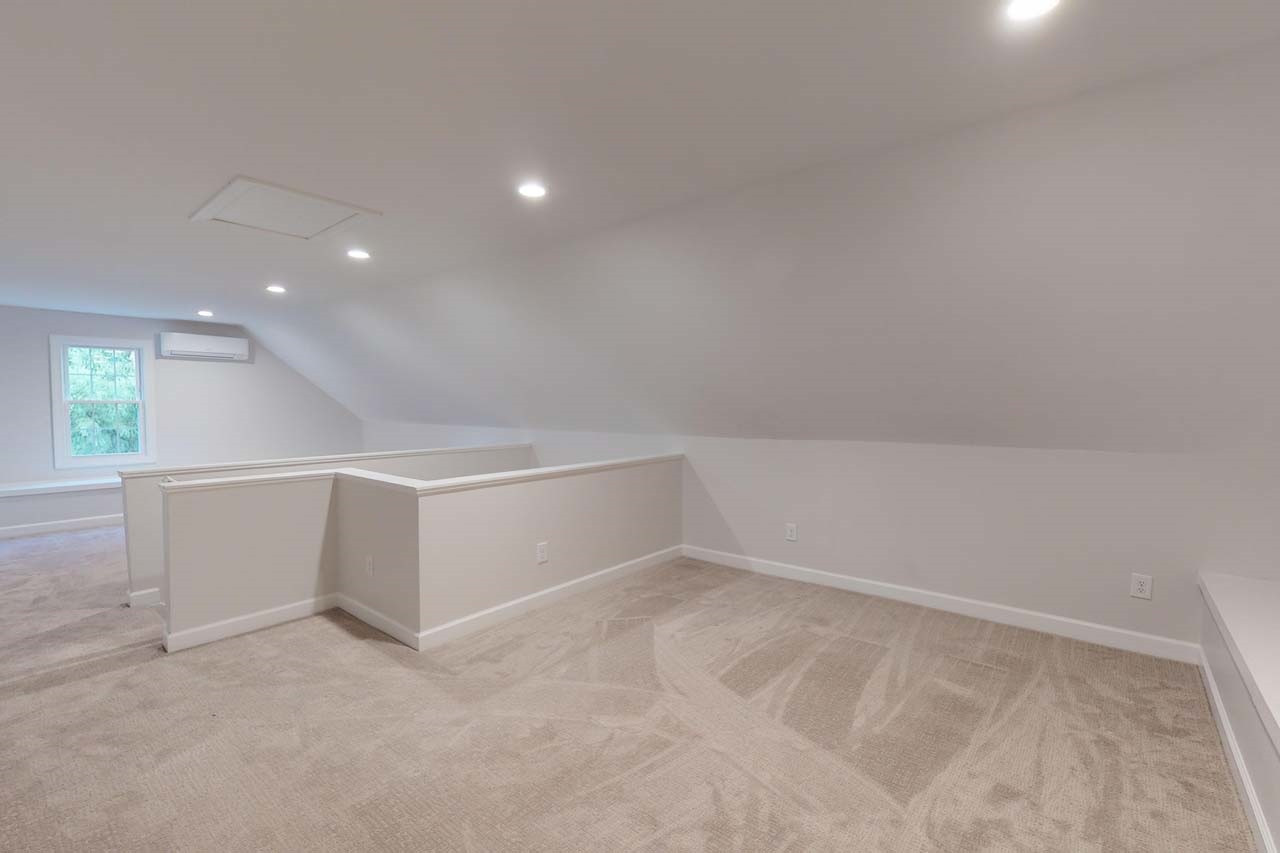 8601 Stanton Place Raleigh, NC 27615 - Photo 21 of 25 Head on up to the 3rd floor where you'll find peace from the bustle of the household. This space would function great as add'l business/office space, podcast studio, workout room or movie room. Professionally finished and permitted in the past year. Third floor bonus space