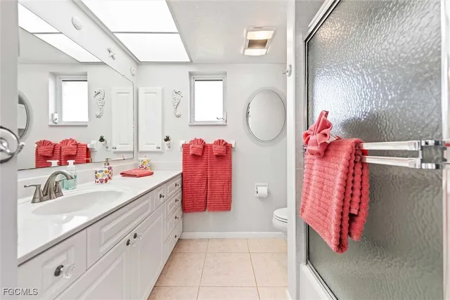 a bathroom with a sink vanity and mirror