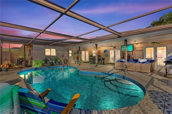 a view of a swimming pool with sitting area