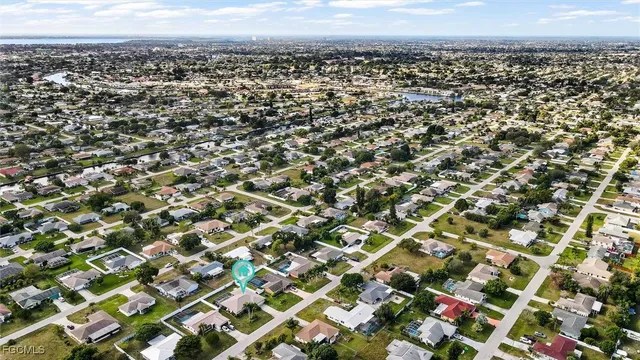 a bedroom with furniture and a large mirror