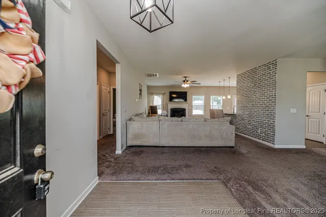 a living room with furniture and a area