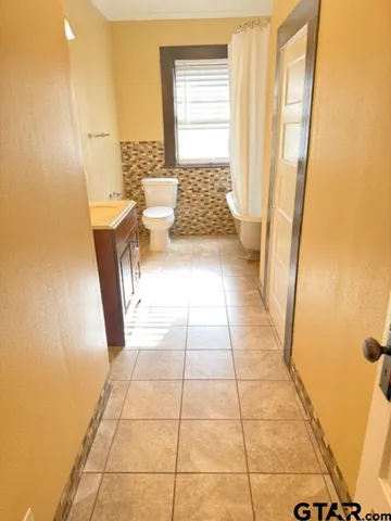 a view of a bathroom with a tub and shower