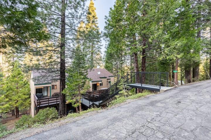 33840 Upper Leland Road, Unit B Pinecrest, CA 95364 - Photo 35 of 35 a front view of a house with a yard and a large tree