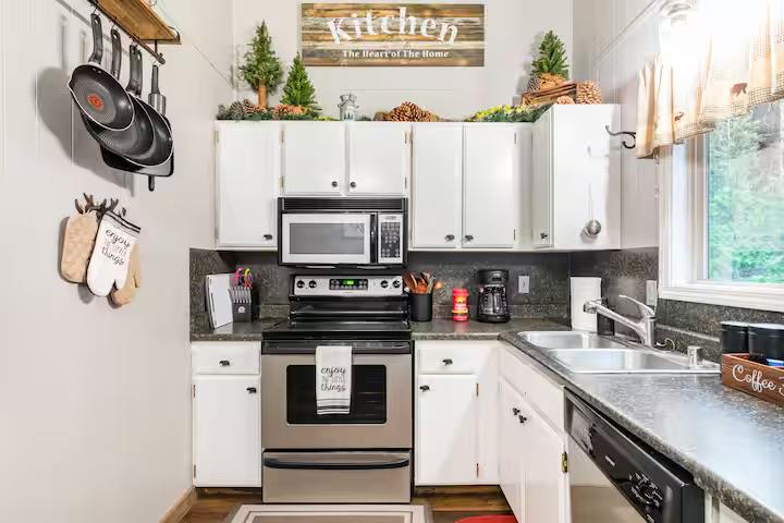 33840 Upper Leland Road, Unit B Pinecrest, CA 95364 - Photo 7 of 35 a kitchen with stainless steel appliances a sink a stove and a refrigerator