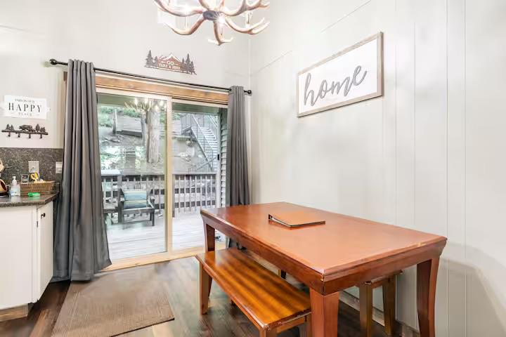 33840 Upper Leland Road, Unit B Pinecrest, CA 95364 - Photo 8 of 35 a view of a dining room with furniture window and wooden floor