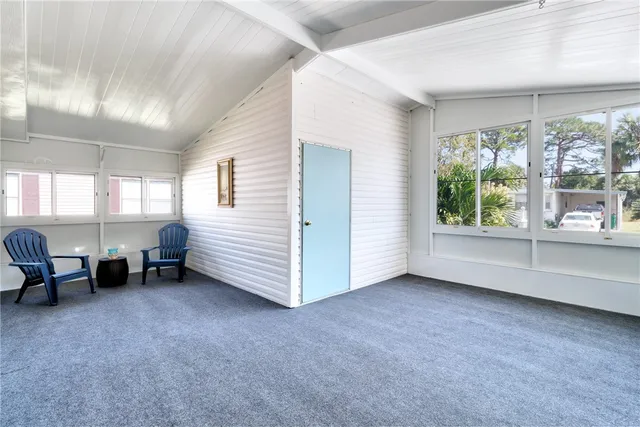 a view of an empty room and a window