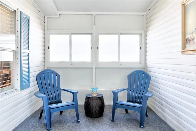 a view of a house with large windows