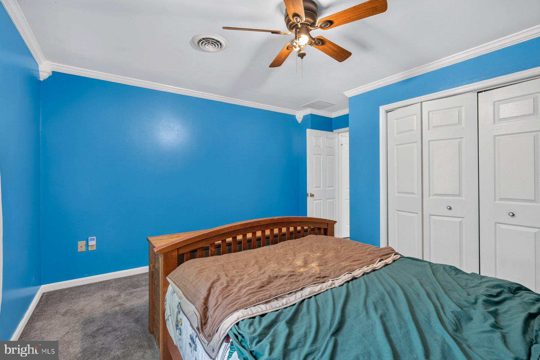 49 Rockland Road Westminster, MD 21158 - Photo 56 of 66 a bedroom with a bed and a chandelier
