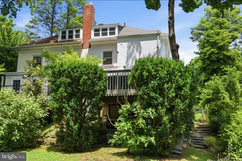 a view of a house with plants and garden