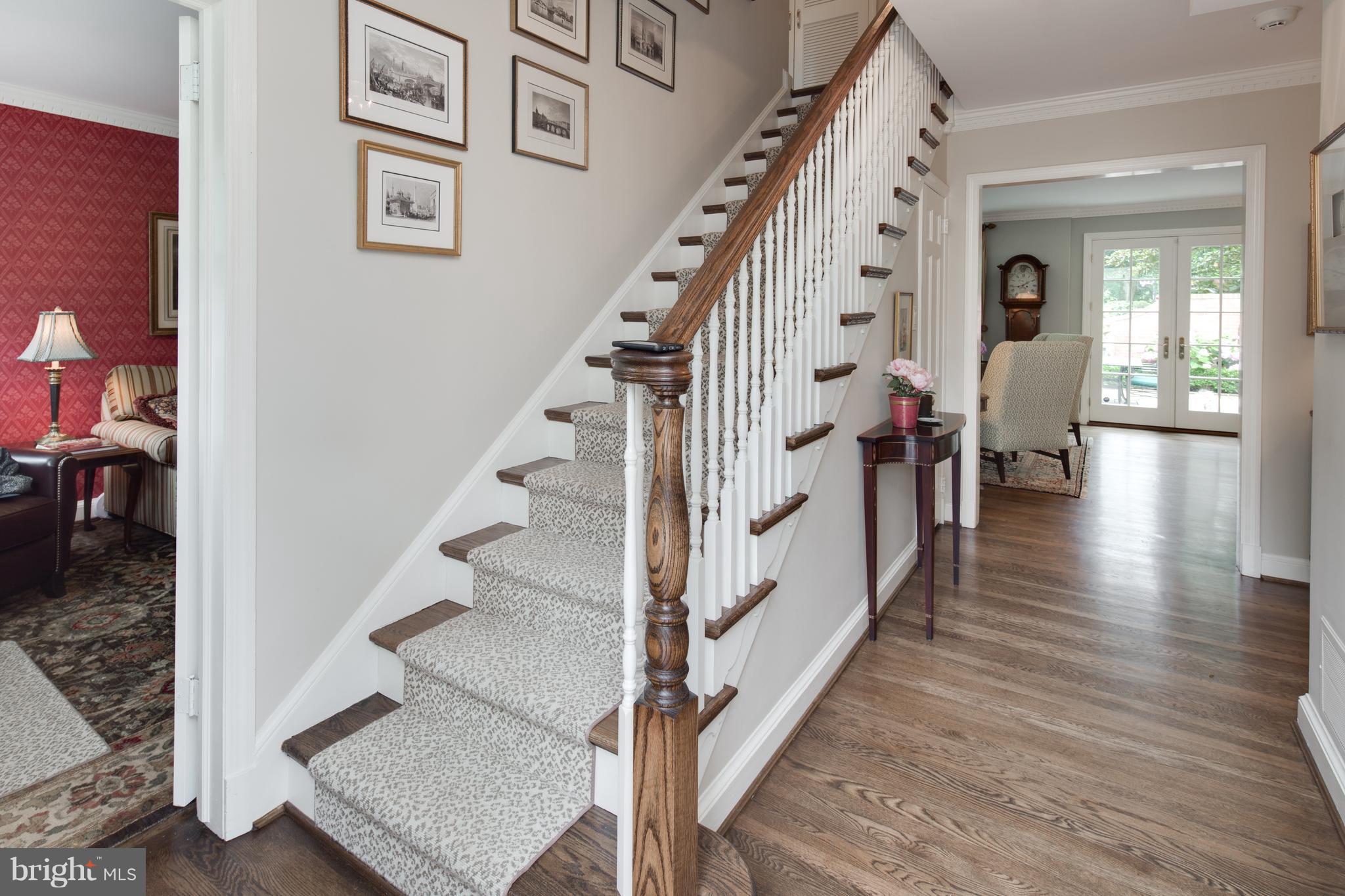 2814 R Street Northwest Washington, DC 20007 - Photo 2 of 30 a view of a hallway with wooden floor and staircase